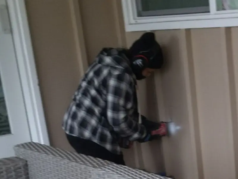 Professional electrician installing an exterior outlet in DeRidder