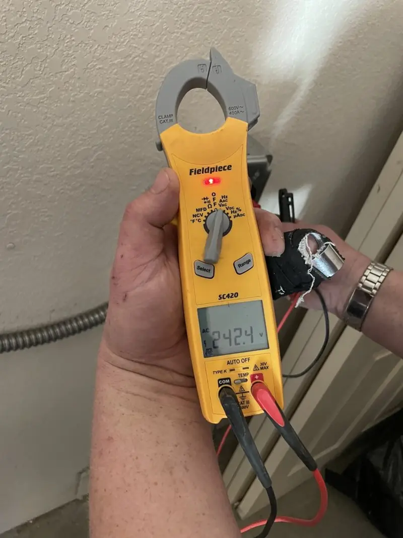 Voltage testing with clamp meter during Ceiling Fan Installation in DeRidder